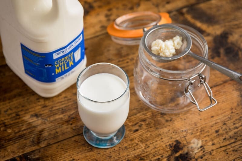 Kefir with strainer and carton of milk