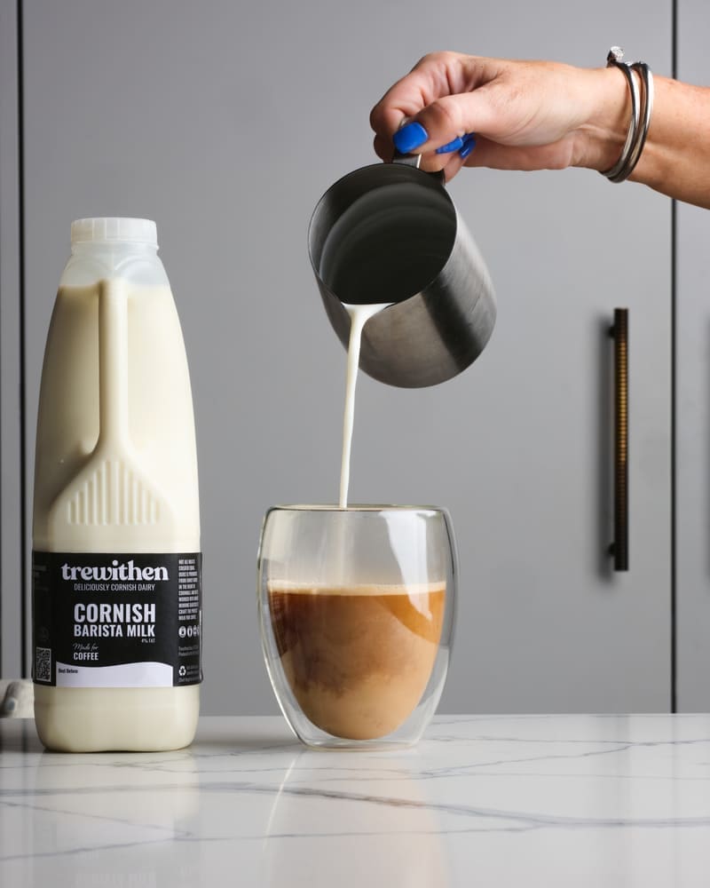 Barista milk being poured into a coffee