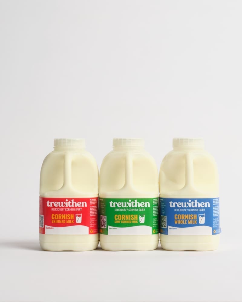 Three cartons of different trewithen milks