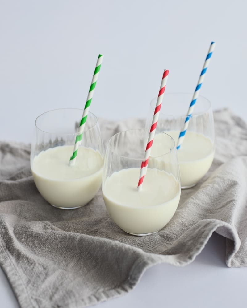 Three glasses of different trewithen milks